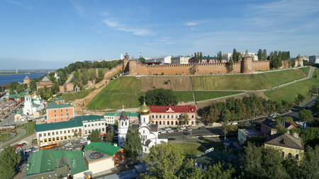 City view with a church and a castle in the background. The buildings are old and the sky is clear.の写真素材