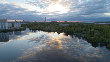 City skyline with a large body of water in the background. The water is reflecting the sky and the buildings. Nizhny Novgorodの写真素材