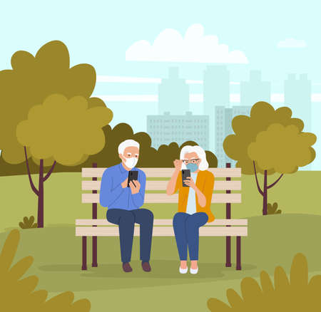 Elderly woman and man in masks are sitting on the bench with smartphones in the park. Vector flat cartoon style illustrationのイラスト素材