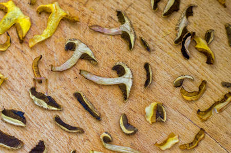 Mushrooms drying on a wooden boardの写真素材