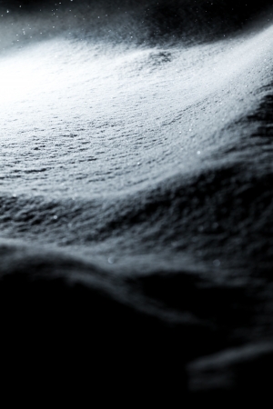 Shiny snow at night during a snow stormの写真素材