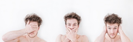 Man shows symbols of the tree wise monkeysの写真素材