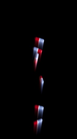 Falling pills and blured motion - isolated on black backgroundの写真素材