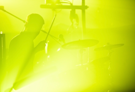 Drumer in silhouette during a concertの写真素材