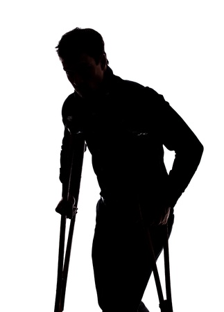 Man with broken leg in silhouette isolated over white backgroundの写真素材