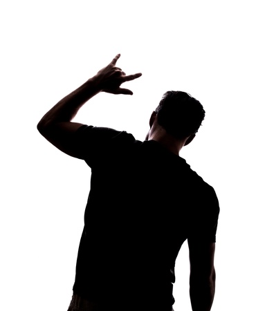 Man rocking on in silhouette isolated over white backgroundの写真素材