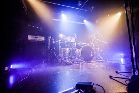 Drumkit on empty stage waiting for musicians の写真素材