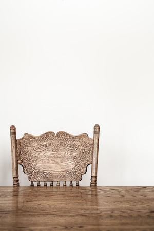 Wooden Dining room table and chair details and blank wall for your text, image or logo.の写真素材