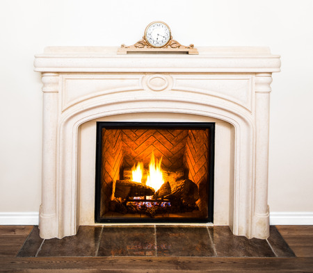 Luxurious White Marble Fireplace Detail and empty white wallの写真素材