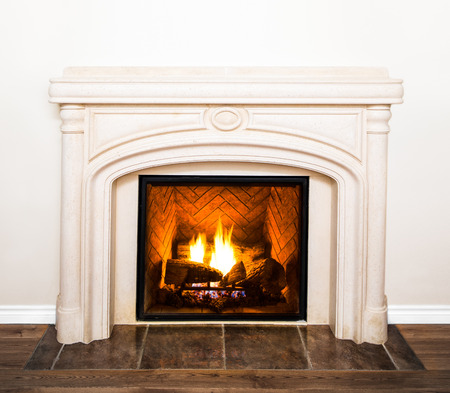 Luxurious White Marble Fireplace Detail and empty white wallの写真素材