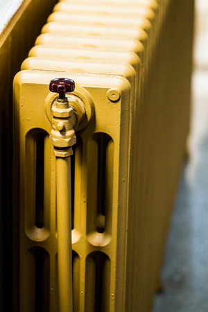 Beige Water Radiator Heater on a Wallの写真素材