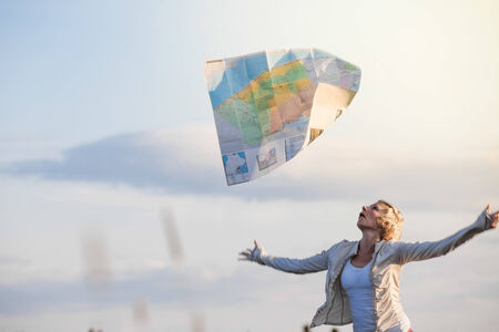Funny Photo of a Young Lost Woman Losing a Map Bacause of the Wind