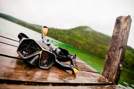 Snorkeling Mask and Tuba on Dock After a Diveの写真素材