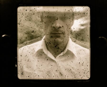 Old Vintage Farmer Portrait using a dusty Cameraの写真素材