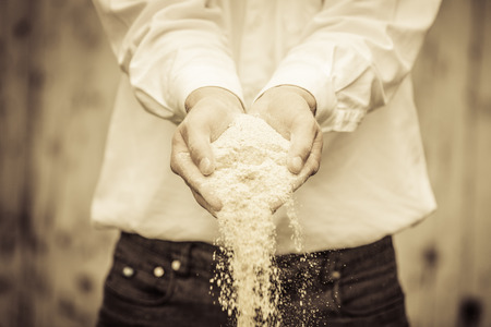 Farmer Showing Animal Dry Food Falling of its handsの写真素材