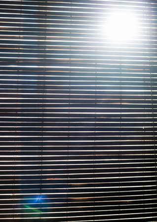 Horizontal Wooden Blinds Closed during the dayの写真素材