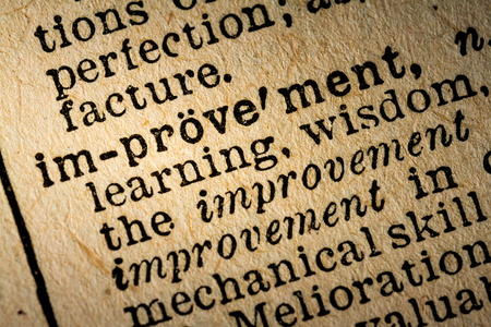 October 6th, 2015 - Montreal, Canada. Old 1945 Webster's Dictionary Macro Close-up of the word IMPROVEMENT and its definition on old textured yellow paper.のeditorial素材