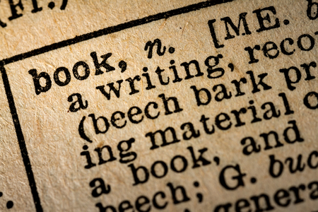October 6th, 2015 - Montreal, Canada. Old 1945 Webster's Dictionary Macro Close-up of the word BOOK and its definition on old textured yellow paper.のeditorial素材