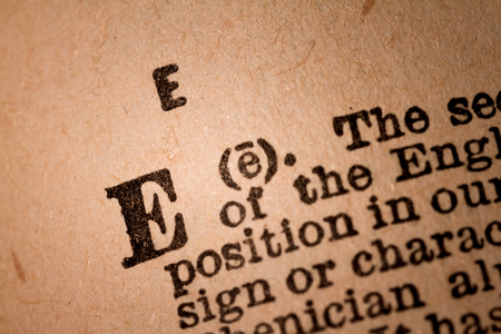 October 1st, 2015 - Montreal, Canada. Close-up of a E, the 5th Letter of the Latin Alphabet into a Old Pronunciation Dictionary October 1st, 2015 - Montreal, Canada. Close-up of a E, the 5th Letter of the Latin Alphabet into a Old Pronunciation Dictionary