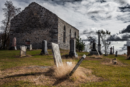 Old Abandoned Irish Cemetery and Church Ruins on a Cold Moody Autumn Dayの写真素材