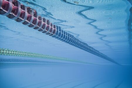 Plastic Swimming Pool Floating Wave-Breaking Lane Line detail from Underwaterの写真素材