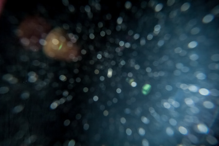 Real Lens Flare Shot in Studio over Black Background. Easy to add as Overlay or Screen Filter over...