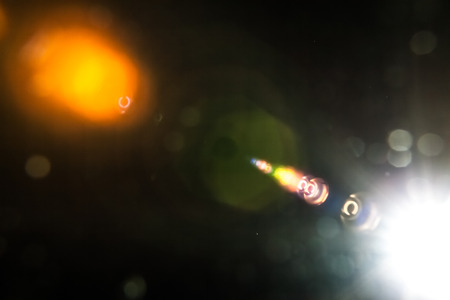 Real Lens Flare Shot in Studio over Black Background. Easy to add as Overlay or Screen Filter over Photosの写真素材