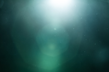 Real Lens Flare Shot in Studio over Black Background. Easy to add as Overlay or Screen Filter over Photosの写真素材