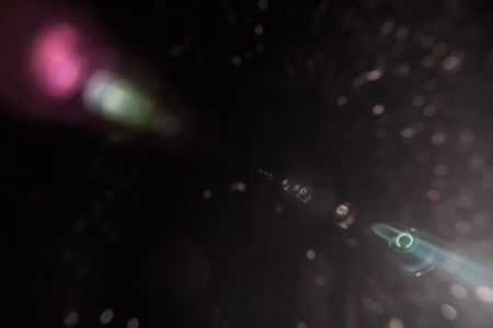Real Lens Flare Shot in Studio over Black Background. Easy to add as Overlay or Screen Filter over Photosの写真素材