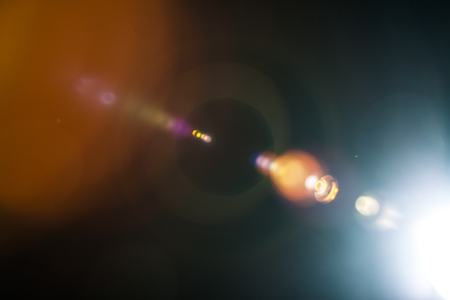 Real Lens Flare Shot in Studio over Black Background. Easy to add as Overlay or Screen Filter over Photosの写真素材