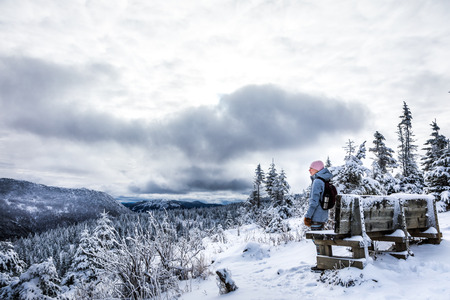 Young Woman at Observatory from Top of Mountain during Winter in Canada, Quebecの写真素材