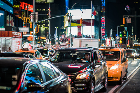 NEW YORK, USA - October 14, 2016. Traffic and Yellow Hybrid Cabs in Times Square at Night, Manhattan, New York.のeditorial素材