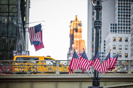 NEW YORK, USA - October 18, 2016. Bridge and USA Flags at the Exit of the Grans Central Subway Station in Manhattan, New York.のeditorial素材