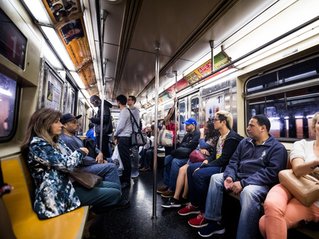 NEW YORK, USA - October 17, 2016. Inside New York City Subway Wagon with Other People in Backgroundのeditorial素材