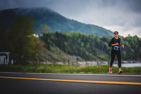 CARLETON, CANADA - June 4, 2017. During the 5th Marathon of Carleton in Quebec, Canada. Young Woman...