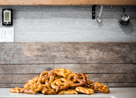 Stack of Fresh Pretzels on the counter top with Rustic background