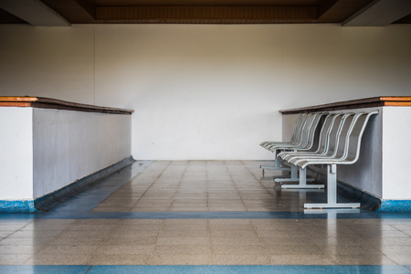 Empty Small row of chairs in waiting room in Caribbean airport.の写真素材