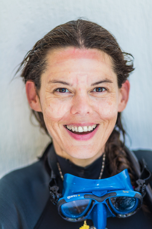 SAN ANDRES ISLAND, Colombia _ Circa March 2017. Funny Smiling  Freediver Portrait after 7 days of Diving and Raccoon Sunburn Print.のeditorial素材