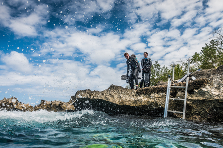 SAN ANDRES ISLAND, Colombia _ Circa March 2017. Group of Freedivers Getting into the Water from the Shore Line in San Andres Island.のeditorial素材