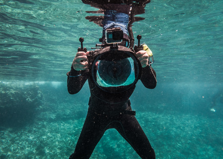SAN ANDRES ISLAND, Colombia _ Circa March 2017. Freediver Photographer with Large Dome, Camera Housing and camera in Caribbean.のeditorial素材