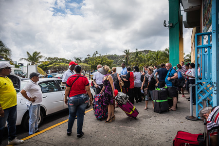 SAN ANDRES ISLAND, Colombia _ Circa March 2017. Colombian Taxi and Shuttles Drivers Waiting for a Batch of Tourists in front of Airport in San Andresのeditorial素材