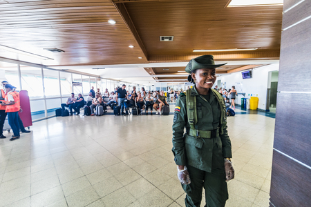 SAN ANDRES ISLAND, Colombia _ Circa March 2017. Gentle Security Staff Inspecting People Coming into the Waiting Room at the San Andres Airport.のeditorial素材