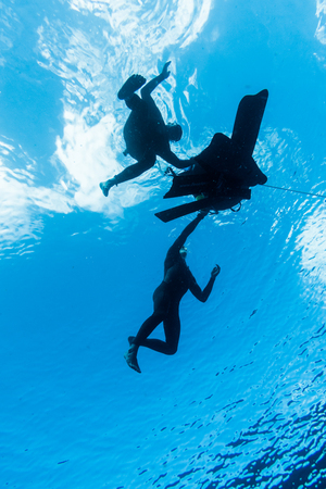 SAN ANDRES ISLAND, Colombia _ Circa March 2017. Freedivers Breathing around the Buoy and Line and Getting Ready for the Next Diveのeditorial素材