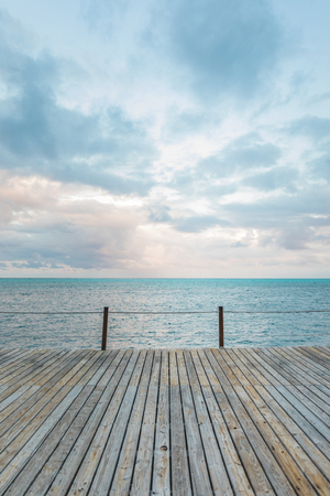 Wooden Pier and Turquoise Caribbean Ocean in Backgroundの写真素材