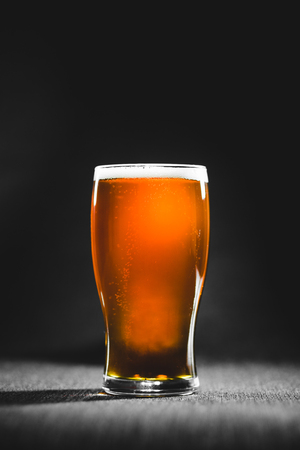 Brown Red Ale Homebrew Beer Pint in Studio with Dramatic lightの写真素材