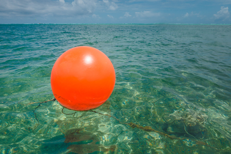 Red Round Buoy in the Caribbean Oceanの写真素材