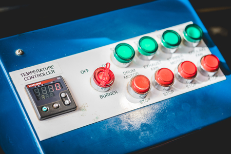 Close-up shot of contemporary industrial control board of industrial coffee roasting machineの写真素材