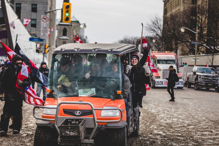 Ottawa, Ontario, Canada - January 30 2022. Quad Transportation during the Convoy for Freedom 2022 Trucks and Tracors Protestのeditorial素材