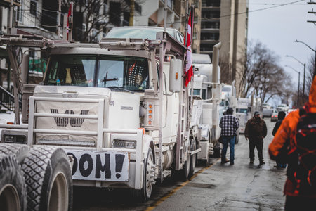 Ottawa, Ontario, Canada - January 29 2022. Convoy for Freedom 2022 Trucks and Tracors Protesting in...