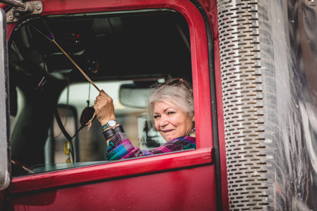 Ottawa, Ontario, Canada - January 30 2022. Female Trucker Honking for the Convoy for Freedom 2022 Trucks and Tracors Protestのeditorial素材